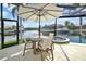 Covered patio with seating area and water views at 1700 Los Alamos Dr, Punta Gorda, FL 33950
