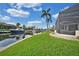 Stunning canal-front property with lush landscaping, spacious patio, and private dock at 1700 Los Alamos Dr, Punta Gorda, FL 33950