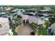 Waterfront home with circular driveway and palm trees at 1700 Los Alamos Dr, Punta Gorda, FL 33950