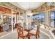 Bright breakfast nook with water views and glass table at 1700 Los Alamos Dr, Punta Gorda, FL 33950