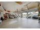 Spacious garage with storage, epoxy floor, and open bay doors at 1700 Los Alamos Dr, Punta Gorda, FL 33950