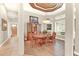 Bright dining room with hardwood floors and a wooden table at 1700 Los Alamos Dr, Punta Gorda, FL 33950