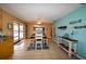 Bright dining room with water view and adjacent kitchen at 4115 Rock Creek Dr, Port Charlotte, FL 33948