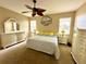 Spacious main bedroom with a king-size bed and ample dresser space at 24479 Vienison Ln, Punta Gorda, FL 33955