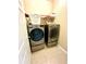 Laundry room with LG washer and dryer, and shelving at 24479 Vienison Ln, Punta Gorda, FL 33955
