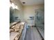 Bathroom features granite countertops, double sinks and a large walk-in shower at 24479 Vienison Ln, Punta Gorda, FL 33955