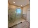Large walk-in shower with built-in seat and grab bars at 24479 Vienison Ln, Punta Gorda, FL 33955