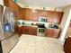 Spacious kitchen with granite countertops and stainless steel appliances at 24479 Vienison Ln, Punta Gorda, FL 33955