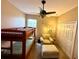 Bedroom with bunk bed, armchair, and ottoman at 24479 Vienison Ln, Punta Gorda, FL 33955