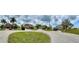 Aerial view of a residential neighborhood with several houses at 24479 Vienison Ln, Punta Gorda, FL 33955