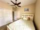 Bedroom with queen bed and ceiling fan at 24479 Vienison Ln, Punta Gorda, FL 33955