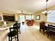 Bright and spacious living room with tile floors, and access to the backyard at 24479 Vienison Ln, Punta Gorda, FL 33955