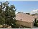 Rear view of house showing tile roof and landscaping at 24479 Vienison Ln, Punta Gorda, FL 33955