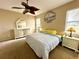 Main bedroom with king-size bed and white dresser at 24479 Vienison Ln, Punta Gorda, FL 33955