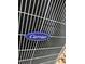 Close-up of Carrier AC unit branding at 24479 Vienison Ln, Punta Gorda, FL 33955