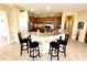 Modern kitchen with granite countertops, breakfast bar and stainless steel appliances at 24479 Vienison Ln, Punta Gorda, FL 33955