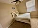 Bedroom with queen bed and ceiling fan at 24479 Vienison Ln, Punta Gorda, FL 33955