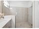 Bathroom with walk-in shower and single vanity at 17130 Jadestone Ct, Venice, FL 34293