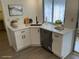 Modern kitchen with white cabinets, stainless steel appliances and quartz countertops at 3303 Ithaca St, Port Charlotte, FL 33952