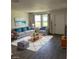 Living Room with gray sofas and a large area rug at 3303 Ithaca St, Port Charlotte, FL 33952