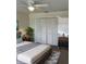 Bright bedroom with a large closet and virtually staged furniture at 3303 Ithaca St, Port Charlotte, FL 33952
