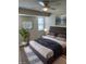 Spacious bedroom with virtually staged furniture and large windows at 3303 Ithaca St, Port Charlotte, FL 33952