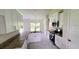 Modern kitchen features granite countertops, stainless steel appliances, and white cabinetry at 174 Aurora St, Port Charlotte, FL 33948