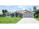 New construction home with gray exterior and two-car garage at 174 Aurora St, Port Charlotte, FL 33948
