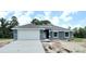 New construction home with attached two-car garage at 909 Biscayne Dr, Port Charlotte, FL 33953