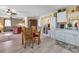 Open concept kitchen and living area with hardwood floors at 24275 Buckingham Way, Punta Gorda, FL 33980