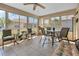 Relaxing sunroom with wicker furniture and backyard views at 24275 Buckingham Way, Punta Gorda, FL 33980