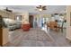 Open living room with dining area and view to backyard at 24275 Buckingham Way, Punta Gorda, FL 33980