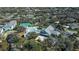 Aerial view of community with pool, tennis courts, and surrounding landscape at 19345 Water Oak Dr # 305, Port Charlotte, FL 33948