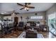 Open living area with hardwood floors, kitchen, and dining area at 19345 Water Oak Dr # 305, Port Charlotte, FL 33948
