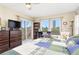 Bright bedroom with water views, a sliding glass door, and a large bed at 3600 Bal Harbor Blvd # 1G, Punta Gorda, FL 33950