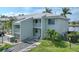 Two-story building with light-green exterior and private balconies at 3600 Bal Harbor Blvd # 1G, Punta Gorda, FL 33950