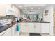 Modern kitchen with breakfast bar and view to living area at 3600 Bal Harbor Blvd # 1G, Punta Gorda, FL 33950