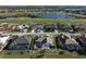 Aerial view of a single-Gathering home with pool in a luxury community at 3853 Bordeaux Dr, Punta Gorda, FL 33950