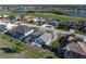 Aerial view showcasing house with pool in a golf course community at 3853 Bordeaux Dr, Punta Gorda, FL 33950