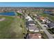 Aerial view of house, pool, and surrounding golf course community at 3853 Bordeaux Dr, Punta Gorda, FL 33950