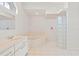 Bathroom with a bathtub, shower, and white cabinets at 3853 Bordeaux Dr, Punta Gorda, FL 33950