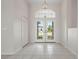 Bright entryway with tile floors and double doors leading outside at 3853 Bordeaux Dr, Punta Gorda, FL 33950