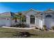 Single-Gathering house with tile roof, landscaping, and two-car garage at 3853 Bordeaux Dr, Punta Gorda, FL 33950