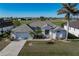 Single-story home with tile roof, two-car garage, and landscaped lawn at 3853 Bordeaux Dr, Punta Gorda, FL 33950