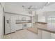 Spacious kitchen with ample counter space and white cabinetry at 3853 Bordeaux Dr, Punta Gorda, FL 33950
