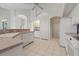 Bright kitchen with white cabinets, tile floor, and stainless steel appliances at 3853 Bordeaux Dr, Punta Gorda, FL 33950