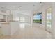 Open concept kitchen with breakfast bar and views of the living room at 3853 Bordeaux Dr, Punta Gorda, FL 33950