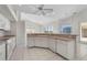 Eat-in kitchen with breakfast bar, view to Gathering room and pool at 3853 Bordeaux Dr, Punta Gorda, FL 33950