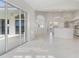 Bright living room with tile floors, sliding glass doors, and views of the backyard at 3853 Bordeaux Dr, Punta Gorda, FL 33950