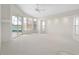 Spacious living room with carpeting, multiple windows, and pool view at 3853 Bordeaux Dr, Punta Gorda, FL 33950